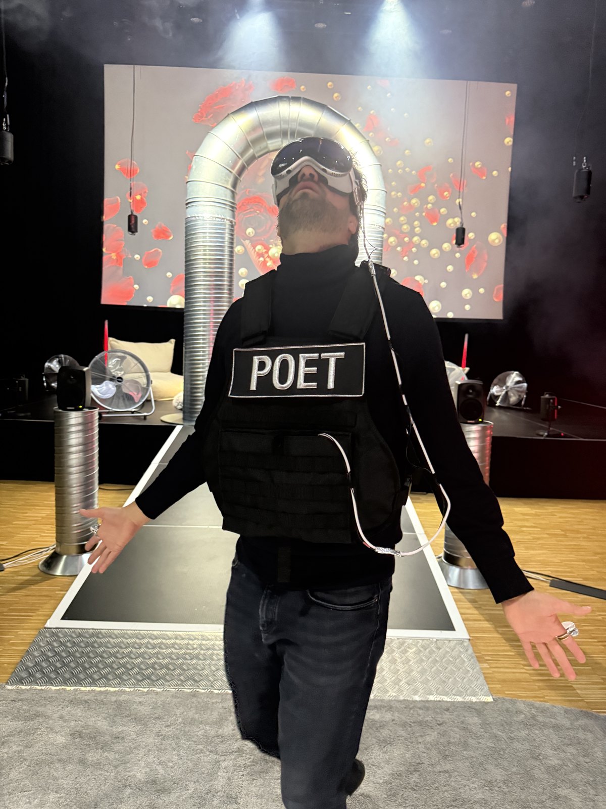 A visitor in the POET vest inside the experience
